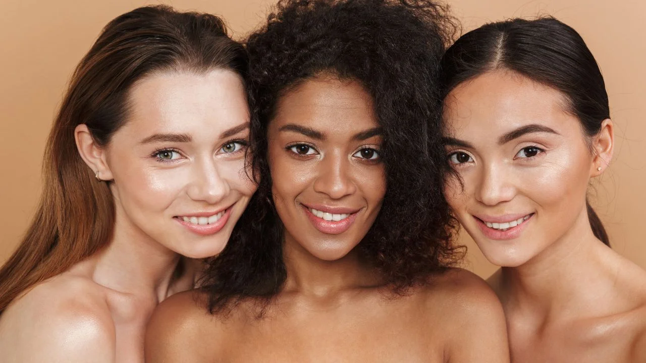 three happy women posing together